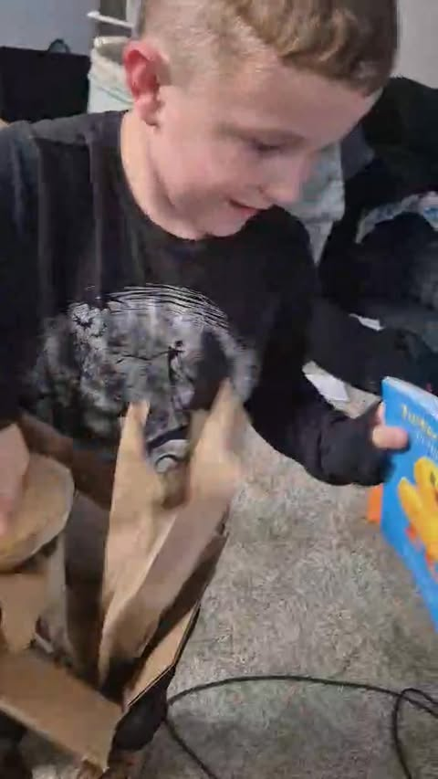 Tucker opening his book and running off to go read both.